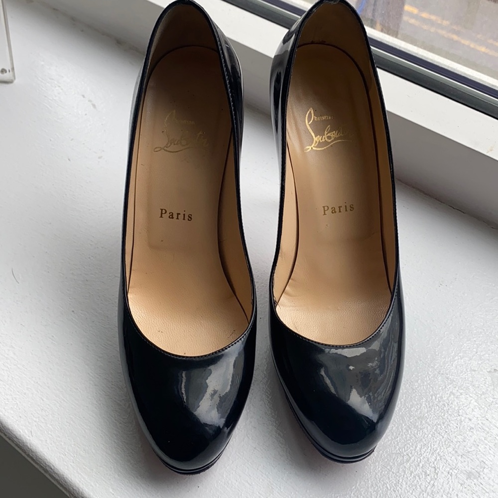 Louboutin black patent leather pumps.